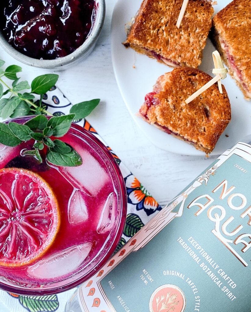 Cranberry Aquavit tonic with grilled cheese