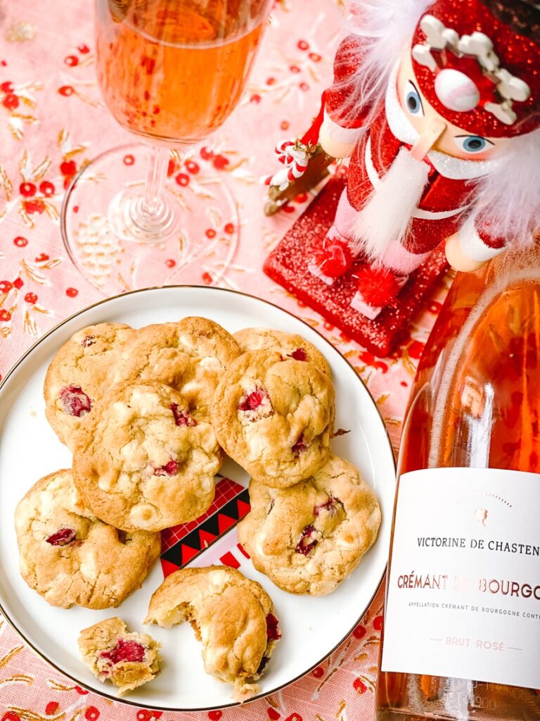 white chocolate cranberry saffron treasure cookies on holiday plate with nutcracker and wine pairing